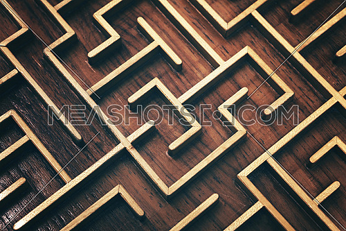 Close up of dark brown wooden labyrinth maze, toy puzzle game, elevated high angle view