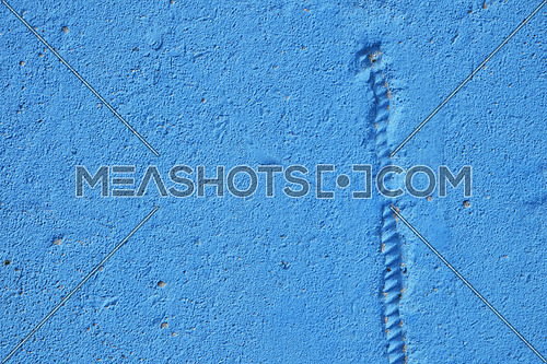 Blue painted concrete wall or floor with paint runs, sagging and armature fitting emboss
