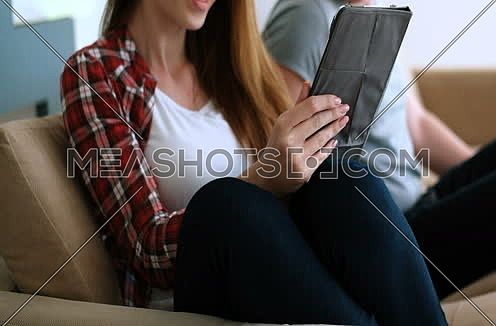 Young Couple using interent on digital tablet