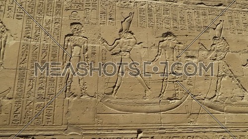 Follow Shot for hieroglyphics writings on a wall inside the Temple of Edfu Egypt.