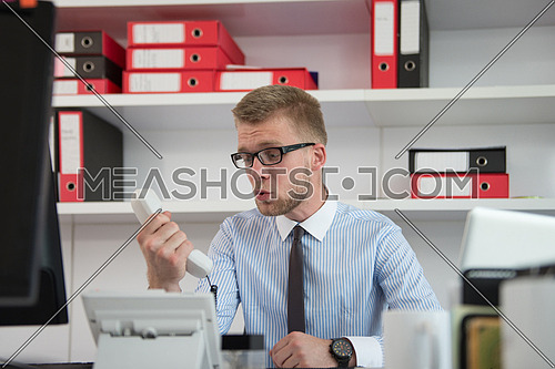 Angry Businessman Yelling Into A Phone