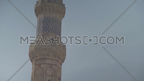 Tilt down Shot for Al-Azhar Mosque's Minaret in Cairo by day