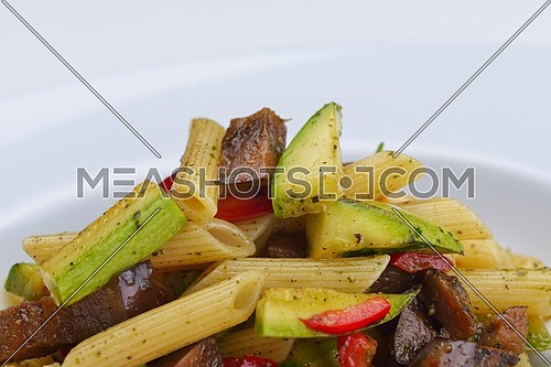 Pasta with shrimps, herbs and mashrooms isolated on white background in studio