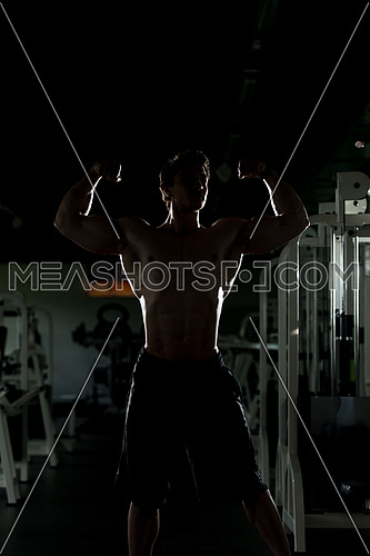 Bodybuilder Posing Silhouette In Different Poses Demonstrating Their Muscles - Male Showing Muscles Straining - Beautiful Muscular Body Athlete