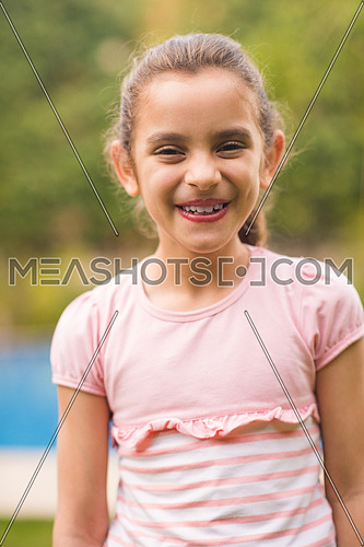 portrait of small middle eastern girl on a sunny summer day