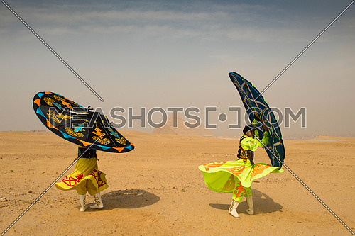 traditional Egyptian sufi dancer performing at Giza pyramids with
