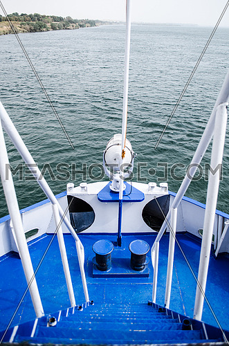 A front deck of a boat in navy blue