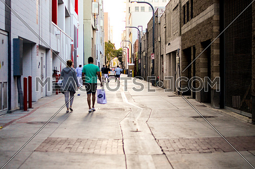people passing by in a side street