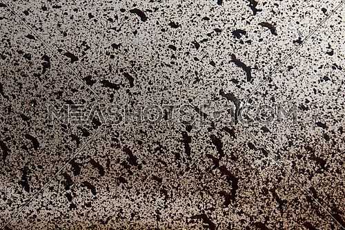 Splash of black paint on white surface