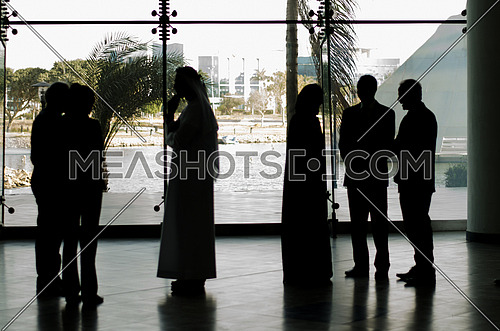 group of people standing in a business meeting