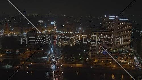 Fly over Kasr El Nile Bridge showing Traffic, Saad Zagloul Statue and The Rivir Nile at night - Novermber 2018