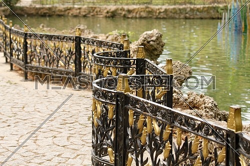 A fence in Emirgan Park that separates the pond from pathway. Istanbul, Turkey