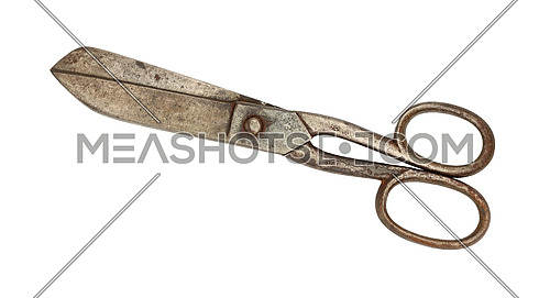 Close up of big old vintage metal closed scissors isolated on white background