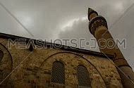 A time laps shot of a Mosque minaret in Bursa, Turkey showing clouds
