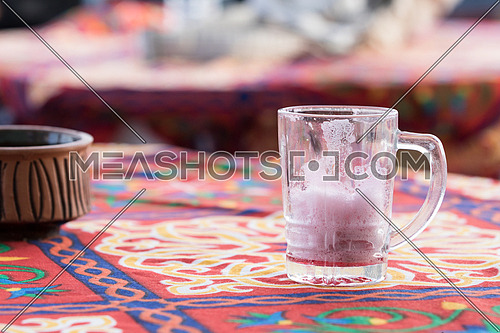 empty glass of hibiscus on table
