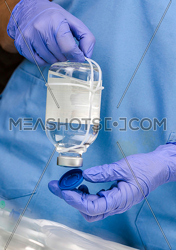 Nurse uncovers medicine bottle in a hospital, conceptual image