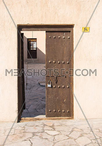 a vitage old wooden door with lock