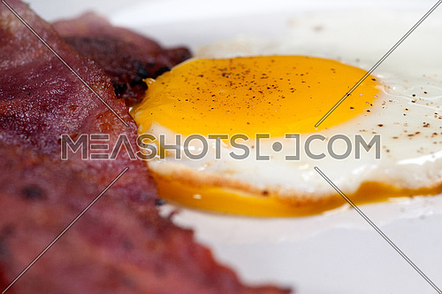 eggs sunny side up with bacon and toast typical english breakfast