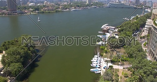 Fly over the River Nile between Buildings  in Cairo at day