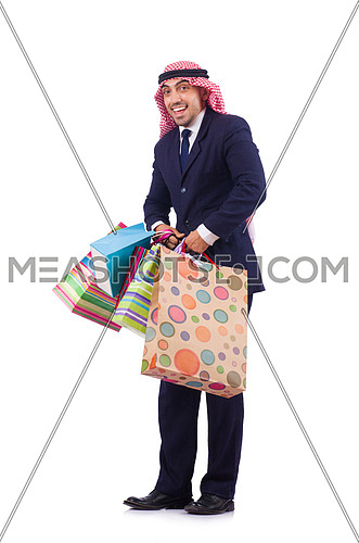 Arab man with shopping gifts on white