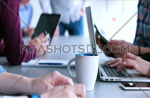 Young Busineswoman Hands Typing On Laptop Computer Keyboard during meeting