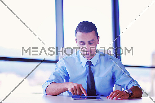 close-up of human hand  business man using tablet compuer at office