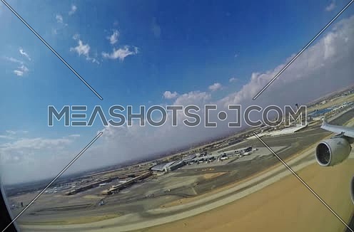 Etihad airways airplane during take off from Cairo airport passenger view