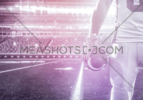 Closeup Portrait of a strong muscular American Football Player on big modern stadium field with lights and flares