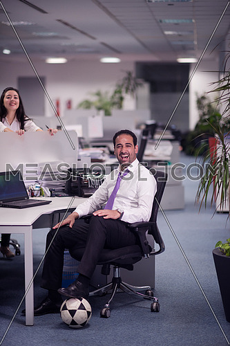 relaxed young couple at office finishing their job