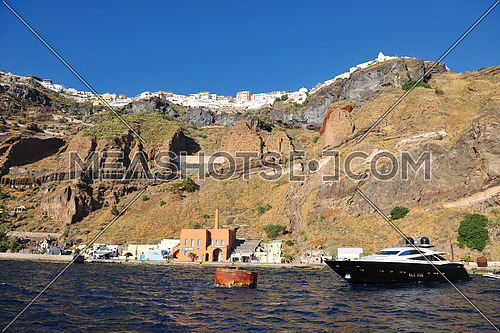 greece santorini island coast with luxury yacht