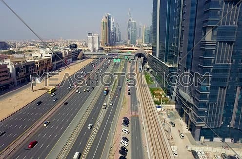 Arial shot for Al Shaikh Zayed Road Using Drone following the train in Dubai At Day