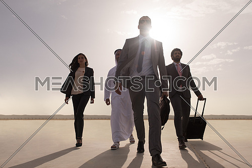 young successful middle eastern businessmen walking the runway with Arab business partner