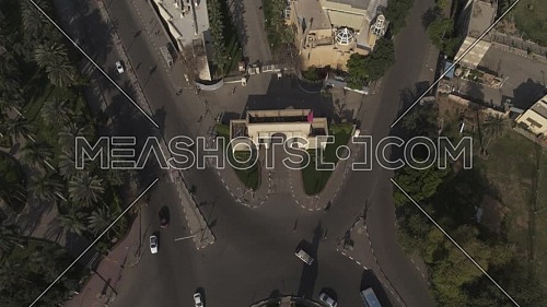 Aerial reveal shot flying over Cairo Downtown empty streets showing Cairo Opera House and Saad Zaghloul Statue during the corona pandemic lockdown by day 10 April 2020