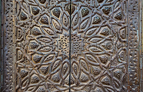 Ornaments of the bronze-plate ornate door of minbar (platform) al Sultan Hasan public mosque, Old Cairo, Egypt