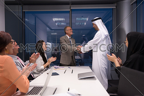 business people make agreement and  handshake on  meeting at modern office ate late night