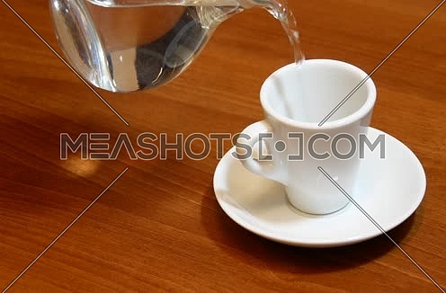 Preparing instant coffee and pouring hot water