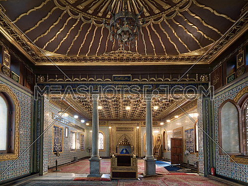 Interior of public mosque of Manial Palace of Prince Mohammed Ali Tewfik with wooden golden ornate ceilings with design based on old logo of the ottoman empire, Cairo, Egypt