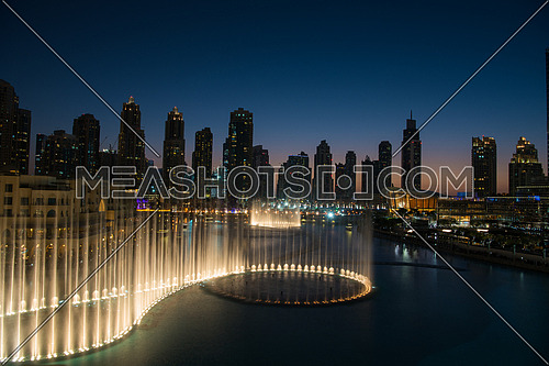 DUBAI UAE 31 JANUARY 2017 famous musical fountain in Dubai with skyscrapers in the background on a beautiful summer evening