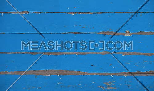 Blue vintage aged painted wooden panel texture background with paint flakes and horizontal planks
