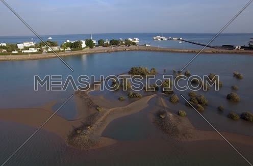 Drone shot flying above lagoon at Day 