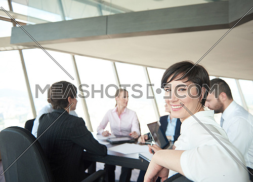 business woman on meeting, people group in background at modern bright office indoors
