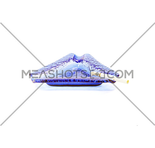 blue murano glass ashtray with lighted cigarette isolated on white background
