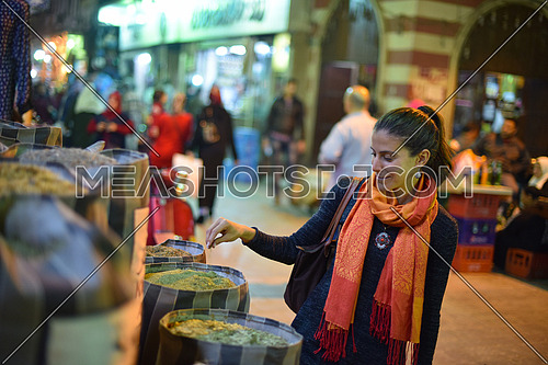 Young middle eastern woman in the traditional street market