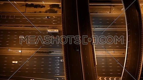 aerial top view of busy traffic on highway in Dubai at night 