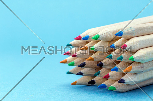 Texture of colored pencils isolated on blue background