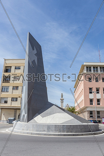 Cadiz Spain- April 1: Monument at roundabout near the entrance to the port of cadiz, in the background is located the monument to the Spanish Constitution of 1812, take in Cadiz, Andalusia, Spain