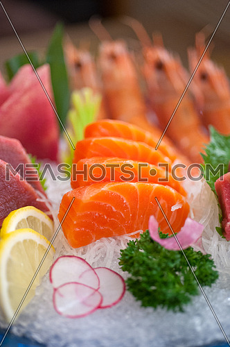 Japanese style assorted sashimi dish laid over crushed ice