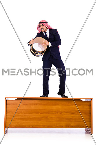 Arab businessman playing drum on desk