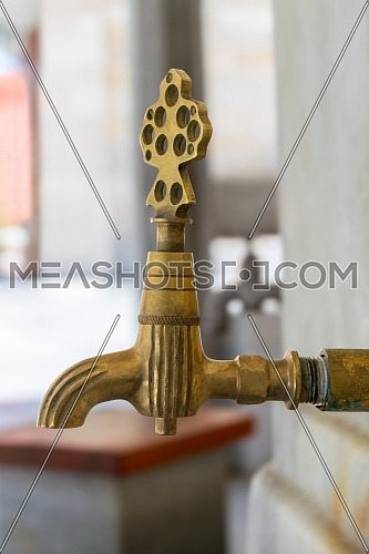Turkish Ottoman style antique ablution tap at the ablution fountain in front of Fatih Mosque, Istanbul, Turkey, includes clipping path