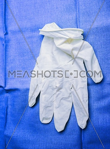 White glove of latex in an operating theater of hospital, conceptual image